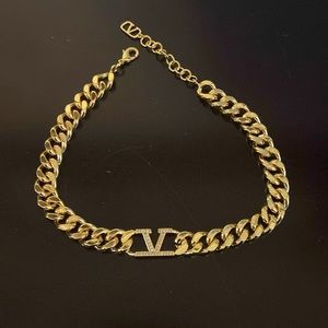 Gold tone choker necklace
